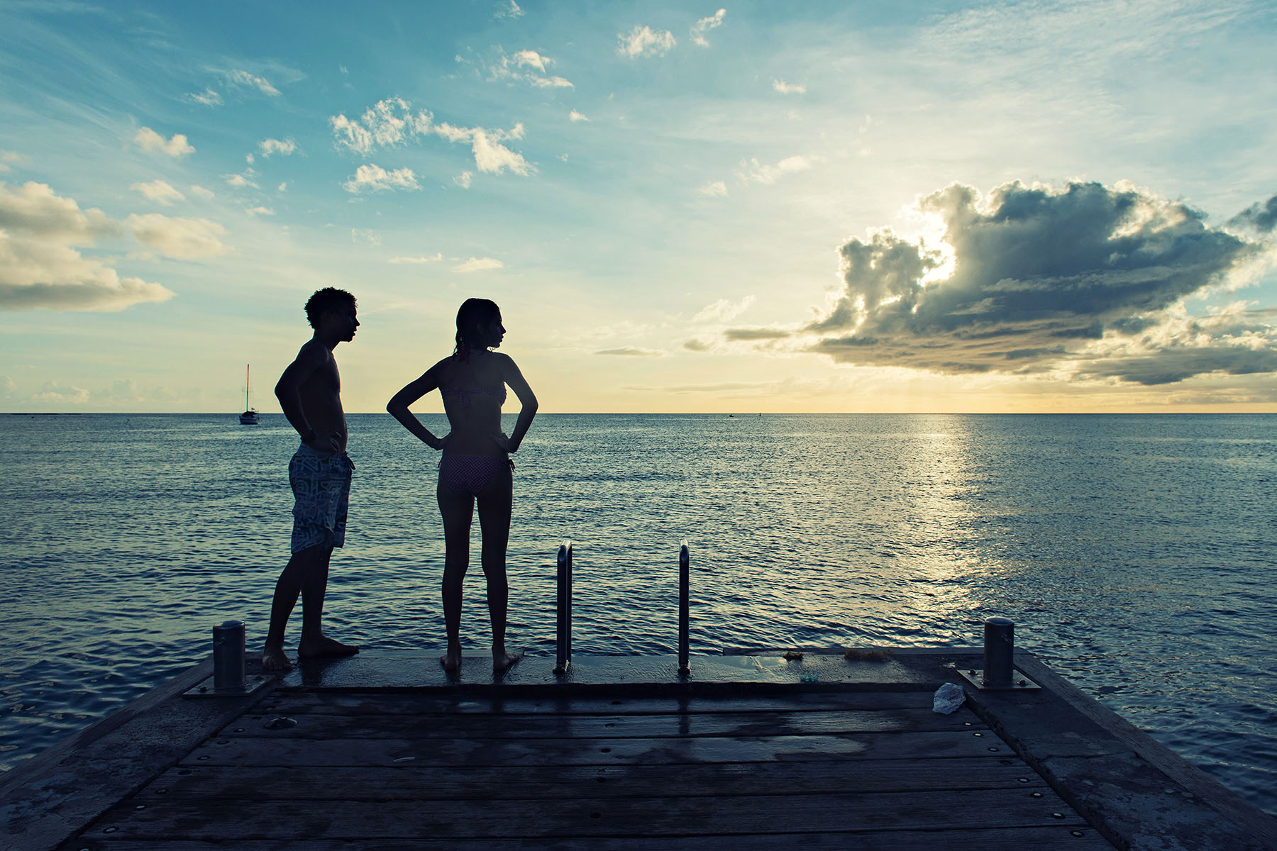 Teens admiring the Sunset at Anse D'Arlet, Martinique, France